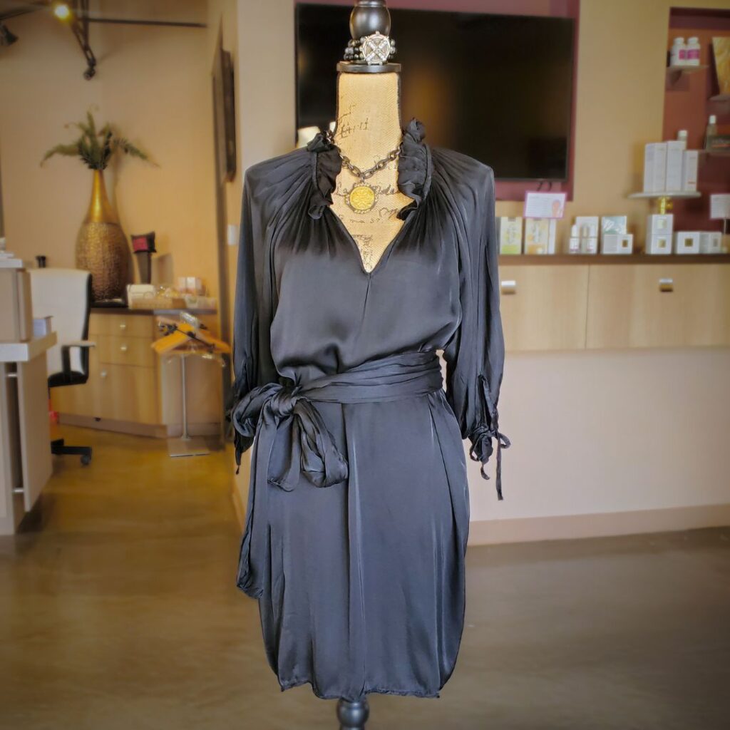 Black silky dress on mannequin
